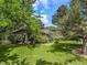 Well maintained house with lush lawn and mature trees in a beautiful landscaped yard at 78 Fairway Ln, Littleton, CO 80123