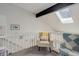 Cozy attic space with skylight, comfortable seating, and unique architectural details at 1885 S Quebec Way # D22, Denver, CO 80231