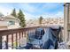 Outdoor balcony offering seating and views of the community townhomes and sky at 1885 S Quebec Way # D22, Denver, CO 80231