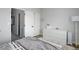 Spacious bedroom with hardwood floors, white trim and a white dresser with lots of storage at 1885 S Quebec Way # D22, Denver, CO 80231