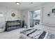 Bright Bedroom with sliding glass doors leading to an outdoor balcony and decorated walls at 1885 S Quebec Way # D22, Denver, CO 80231