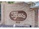 Image shows community sign for Topaz at Indian Creek on a brick wall at 1885 S Quebec Way # D22, Denver, CO 80231