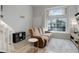 Living space features a large window, a comfortable sofa, and stairs to loft at 1885 S Quebec Way # D22, Denver, CO 80231