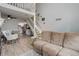 Open living space with loft, showing a modern kitchen, and a large comfy sofa at 1885 S Quebec Way # D22, Denver, CO 80231