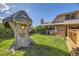 Backyard featuring a treehouse, lawn, and a built-in outdoor grill at 6708 W Portland Ave, Littleton, CO 80128