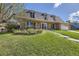 Beautiful home with manicured lawn, dormer windows, and attached garage at 6708 W Portland Ave, Littleton, CO 80128