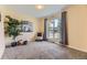 Inviting living room featuring a large window with natural light, neutral walls, and plush carpeting at 6708 W Portland Ave, Littleton, CO 80128