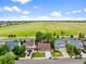 An aerial view of a residential neighborhood featuring neat homes, green spaces, and a convenient location near the highway at 5428 Suffolk Ave, Castle Rock, CO 80104