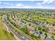 Picturesque suburban neighborhood featuring charming homes, green spaces, and scenic mountain views against a clear blue sky at 5428 Suffolk Ave, Castle Rock, CO 80104