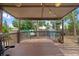 Spacious deck with string lights provides an excellent outdoor entertainment area overlooking a well-maintained backyard at 5428 Suffolk Ave, Castle Rock, CO 80104