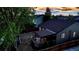 An aerial view of the backyard, showcasing a deck, lush trees, and the surrounding neighborhood landscape at 5428 Suffolk Ave, Castle Rock, CO 80104
