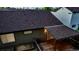 A high-angle view of the home's roof and backyard, highlighting the well-maintained wooden deck and surrounding landscaping at 5428 Suffolk Ave, Castle Rock, CO 80104