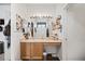 A clean, functional bathroom with a well-lit vanity, storage, and a view to the toilet and shower room at 5428 Suffolk Ave, Castle Rock, CO 80104