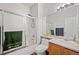 Functional bathroom includes a glass-enclosed shower, vanity, sink, and an adjacent toilet for convenience and privacy at 5428 Suffolk Ave, Castle Rock, CO 80104