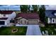 This charming home features a well-kept lawn, a convenient two-car garage, and classic architectural details at 5428 Suffolk Ave, Castle Rock, CO 80104