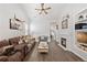 This inviting living room features hardwood floors, a cozy fireplace, and stylish decor at 5428 Suffolk Ave, Castle Rock, CO 80104