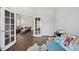 This flex space is well-lit and open to the living room with hardwood floors and access to a door at 5428 Suffolk Ave, Castle Rock, CO 80104