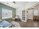 This adaptable home office is complete with hardwood floors, natural light, and easy access to the living room at 5428 Suffolk Ave, Castle Rock, CO 80104