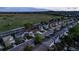 Beautiful street view of modern homes in a Gathering-friendly neighborhood with mountain views in the background at 5428 Suffolk Ave, Castle Rock, CO 80104
