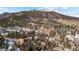 Panoramic aerial view of a mountain community with mature trees and stunning natural landscape at 3064 Elk View Dr, Evergreen, CO 80439