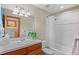Bathroom featuring a tub and shower combo, vanity and sink at 3064 Elk View Dr, Evergreen, CO 80439