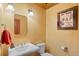 Bathroom with a sink, toilet, and wall decor at 3064 Elk View Dr, Evergreen, CO 80439