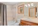 Bathroom featuring a tub and shower combo with a vanity and sink at 3064 Elk View Dr, Evergreen, CO 80439