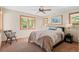 Comfortable bedroom featuring a ceiling fan, nice carpet and a light colored wall at 3064 Elk View Dr, Evergreen, CO 80439