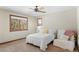 Cozy bedroom with a window view and seating; perfect for relaxation and rest at 3064 Elk View Dr, Evergreen, CO 80439
