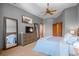 Primary bedroom with neutral paint, a ceiling fan, and ample closet space at 3064 Elk View Dr, Evergreen, CO 80439