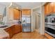 Kitchen area with stainless steel appliances, granite countertops, wood floors and cabinets at 3064 Elk View Dr, Evergreen, CO 80439