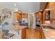 Open concept kitchen with stainless steel appliances and a breakfast bar for additional seating and counter space at 3064 Elk View Dr, Evergreen, CO 80439