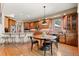 Spacious kitchen with wooden cabinets, stainless steel appliances and a granite countertop island with bar stool seating at 3064 Elk View Dr, Evergreen, CO 80439