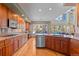 Gourmet kitchen features stainless steel appliances, granite countertops, a large window and a breakfast bar at 3064 Elk View Dr, Evergreen, CO 80439