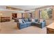 Spacious living area with a comfortable sectional sofa, pool table and natural light at 3064 Elk View Dr, Evergreen, CO 80439