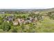 Scenic aerial view of a residential neighborhood nestled among lush trees and green spaces at 229 Berthoud Way, Golden, CO 80401