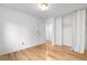 Bright bedroom with wood flooring, neutral walls, and access to closet at 229 Berthoud Way, Golden, CO 80401