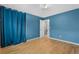 Bedroom featuring blue accent wall, hardwood floors and closet at 229 Berthoud Way, Golden, CO 80401