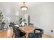 Comfortable dining room with hardwood floors and an adjoining living space at 229 Berthoud Way, Golden, CO 80401