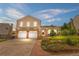 Charming two-story home featuring a well-manicured lawn and a two-car garage at 229 Berthoud Way, Golden, CO 80401