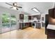 Well-equipped kitchen featuring hardwood floors, stainless steel appliances, and backyard access at 229 Berthoud Way, Golden, CO 80401