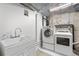 Functional laundry room equipped with a modern washer, dryer, and utility sink for added convenience at 229 Berthoud Way, Golden, CO 80401