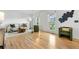 Sunlit living room showcasing hardwood floors and comfortable seating at 229 Berthoud Way, Golden, CO 80401