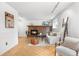 Basement living room with brick fireplace and a cozy seating area at 229 Berthoud Way, Golden, CO 80401