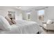 Bright main bedroom with two windows and a view of the neighborhood at 229 Berthoud Way, Golden, CO 80401