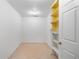 Simple room with tile flooring and a built-in shelf next to a white door at 229 Berthoud Way, Golden, CO 80401