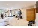 Spacious basement with exercise equipment and ample space at 702 Windmill Pl, Highlands Ranch, CO 80126