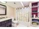 Compact bathroom with a shower-tub combo, modern vanity and shelving for storage at 702 Windmill Pl, Highlands Ranch, CO 80126