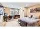 Finished basement bedroom with room for a desk, tv, and queen sized bed at 702 Windmill Pl, Highlands Ranch, CO 80126