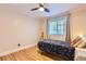Bright bedroom featuring hardwood floors and natural light at 702 Windmill Pl, Highlands Ranch, CO 80126